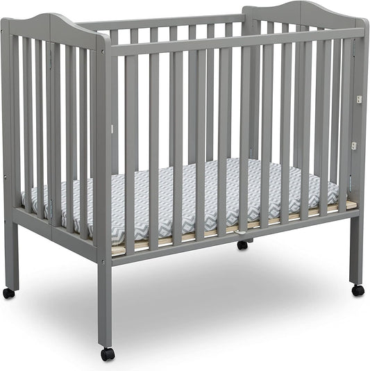 Delta Children Folding Portable Mini Baby Crib for Small Spaces