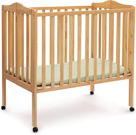 Delta Children Folding Portable Mini Baby Crib for Small Spaces