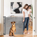 Retractable Dog Gates for Doorways 55 in Wide - Space-Saving Safety